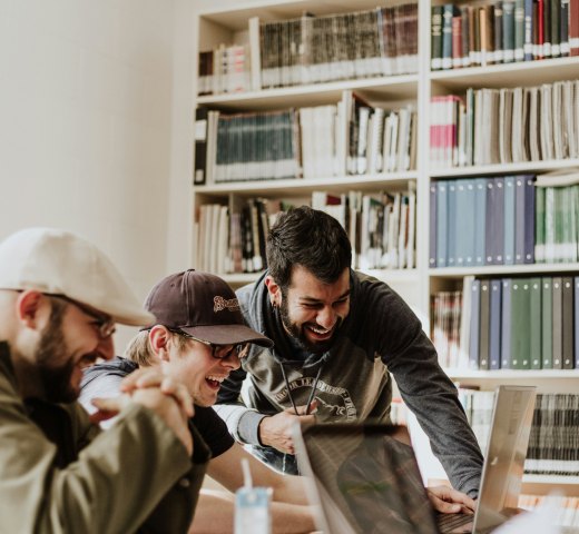 Tasklane founders collaborating in a library